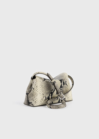 Python-embossed leather clutch by TOTEME. Signature T-Lock fastening, removable strap for crossbody wear. Lined interior with card slot. Italian-crafted.