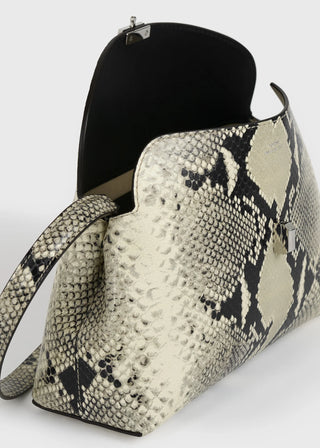 Python-embossed leather clutch by TOTEME. Signature T-Lock fastening, removable strap for crossbody wear. Lined interior with card slot. Italian-crafted.