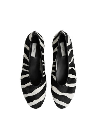 TOTEME pony hair ballerinas. A bold, minimalist slip-on with a modern squared toe and luxurious texture. Italian craftsmanship. Available at our Lisbon store. 
