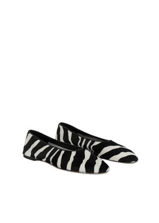 TOTEME pony hair ballerinas. A bold, minimalist slip-on with a modern squared toe and luxurious texture. Italian craftsmanship. Available at our Lisbon store. 