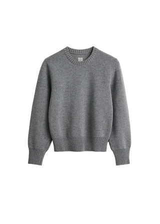 Crew-neck knit with a wide, ribbed hem and subtly rounded sleeves for sculptural volume. Made from a compact merino wool-cotton blend. Available at our Lisbon store. 