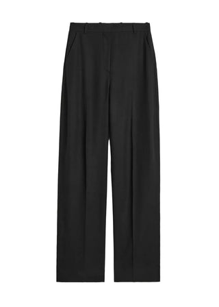 High-waist trousers crafted from softly structured flannel with straight, wide legs and pressed front creases. Available at our Lisbon store. 