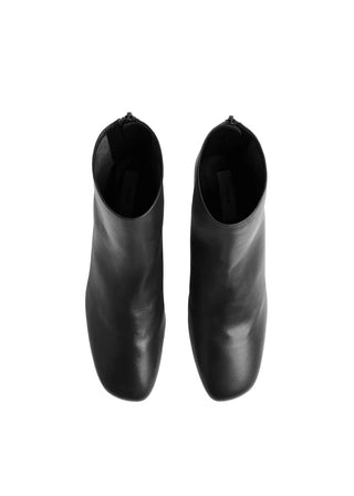 TOTEME nappa mid-heel boots. Soft leather, sock-like fit, and a refined kitten heel. Effortless  elegance, available at our Lisbon store. 
