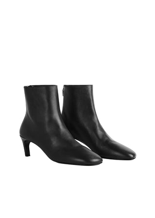 TOTEME nappa mid-heel boots. Soft leather, sock-like fit, and a refined kitten heel. Effortless  elegance, available at our Lisbon store. 
