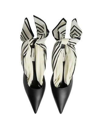 Sharp-toed mules that reimagine the signature TOTEME silk scarf as a slingback tie. Crafted in Italy from soft nappa leather and set on a sculptural 55mm heel.