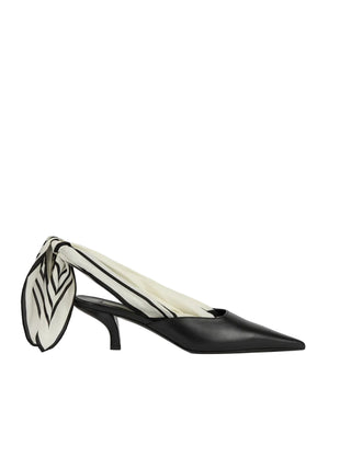 Sharp-toed mules that reimagine the signature TOTEME silk scarf as a slingback tie. Crafted in Italy from soft nappa leather and set on a sculptural 55mm heel.