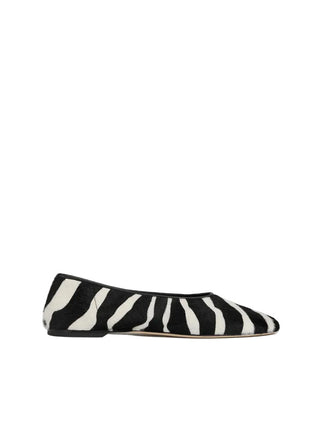 TOTEME pony hair ballerinas. A bold, minimalist slip-on with a modern squared toe and luxurious texture. Italian craftsmanship. Available at our Lisbon store. 