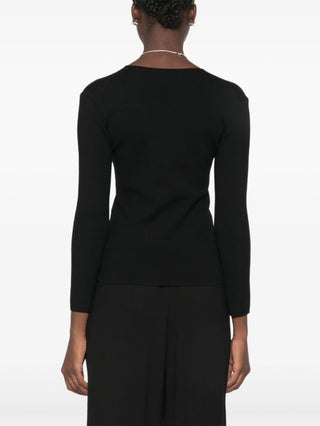 Crafted from fine yarns, this V-neck sweater offers a relaxed fit and soft handfeel. Minimalist luxury at its best.
