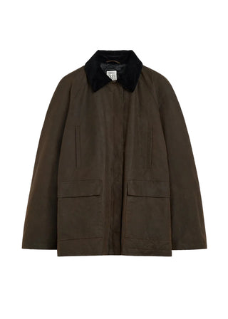 TOTEME Zipped Country Jacket. Relaxed, oversized fit in organic waxed cotton. Features a corduroy collar, zip fastening, and patch pockets. 
