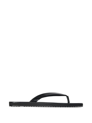 The Row black City Flip Flop with sleek design and comfortable insole — available at our Lisbon store.