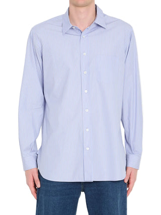 Light blue striped shirt by The Row worn with blue jeans