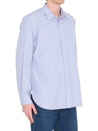 Person wearing a light blue striped shirt with blue jeans