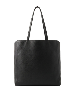 The Row Karolin tote. A sculptural bag in soft leather with elegant handles. Minimalist luxury from the masters of quiet style. Available at our Lisbon store.