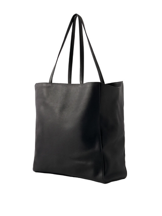 The Row Karolin tote. A sculptural bag in soft leather with elegant handles. Minimalist luxury from the masters of quiet style. Available at our Lisbon store.