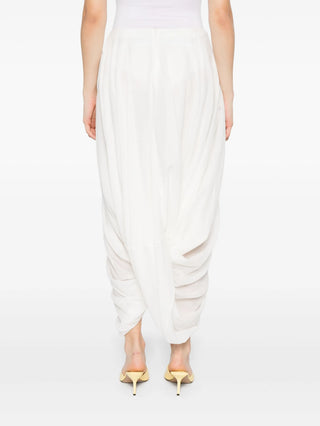 Sculptural high-waist skirt with a rounded, cocoon-like silhouette. A modern staple in premium fabric for a refined, architectural look.