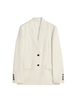 Beige blazer with black buttons by Toteme