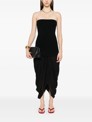 TOTEME's Cocoon Skirt. Structured volume, clean lines, and a signature curved hem. Modern elegance redefined for the discerning minimalist.