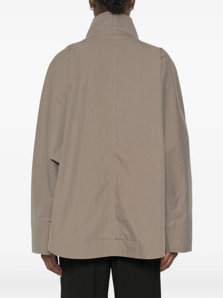 Lightweight summer jacket with a relaxed parachute silhouette. Breathable fabric and effortless styling from TOTEME. Available at our Lisbon store. 