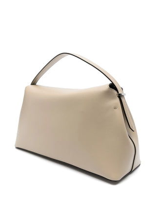 Sculptural leather clutch with a signature T-lock closure. A minimalist statement piece for day or night, crafted from premium leather.
