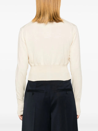 Vivienne Westwood Bea Cropped Cardi. Roomy cropped silhouette with a multi-coloured Orb embroidery and amber button fastenings. Available at our Lisbon store. 