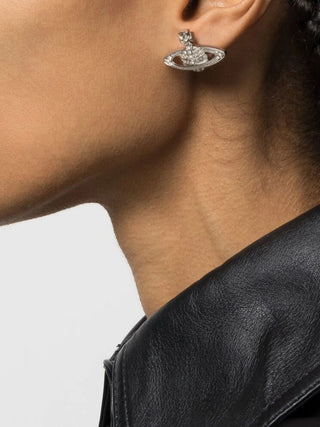 Vivienne Westwood Mini Bas Relief earrings. The iconic orb design with intricate cut-out detailing and crystal accents. Available at our Lisbon store.