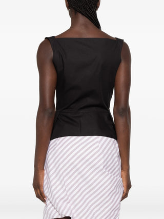 Monday vest with a long-line silhouette, fitted waist, and wide shoulder straps. Features a front button placket and small embroidered Orb logo. 