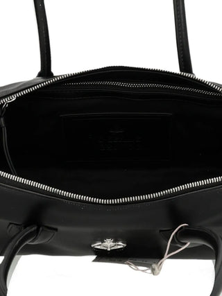 Vivienne Westwood Polly Bowling Bag. Signature 3D Orb, faux leather, and a structured silhouette. Timeless style. Available at our Lisbon store.