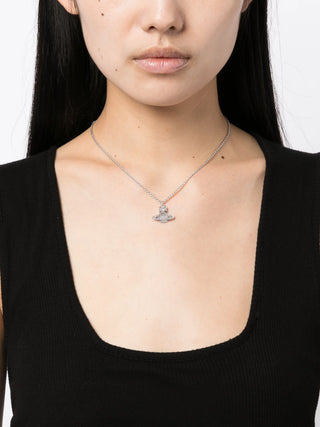 Carmela Bas Relief pendant in silver-tone brass with crystal embellishments. Features the signature two-dimensional Orb motif and adjustable chain.