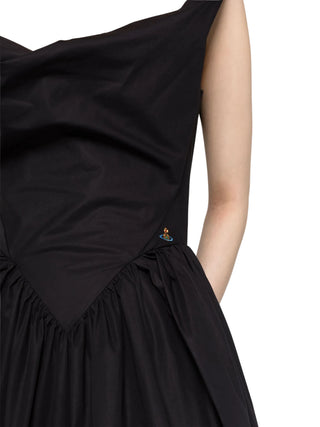 Crafted from organic cotton poplin, this dress showcases a sculpted, corset-inspired bodice and a midi-length skirt. Available at our Lisbon store. 