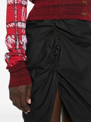 Mini Side Panther skirt with side gathering, draped detailing, and an asymmetric hem. Buttoned waistband and concealed zip. Available at our Lisbon store.