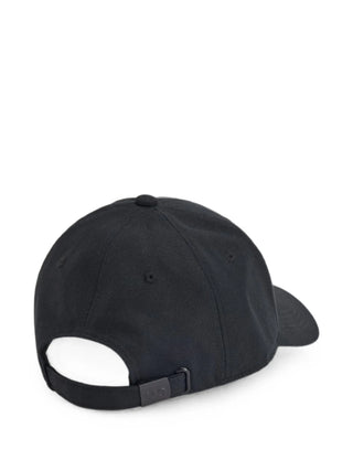 Y-3 logo-patch baseball cap in black. Embroidered front logo, curved peak, six-panel construction, and adjustable strap. Available at our Lisbon store.