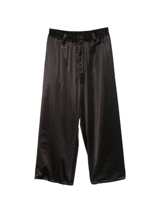 Y-3 drawstring satin trousers. A luxe silhouette with gradient side stripes, D-ring, and a drawstring waist. Available at our Lisbon store.