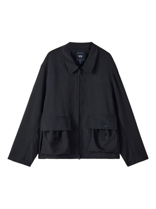 Y-3 black blouson jacket with logo detail, patch pockets and relaxed fit. Sport-inspired layer, available at our Lisbon store.