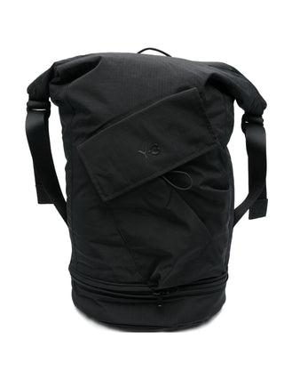 Black backpack with Y-3 logo and adjustable straps. 