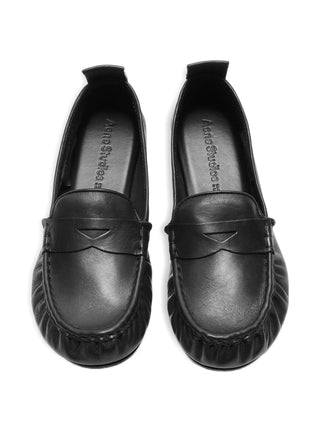 Black leather loafers by Acne Studios