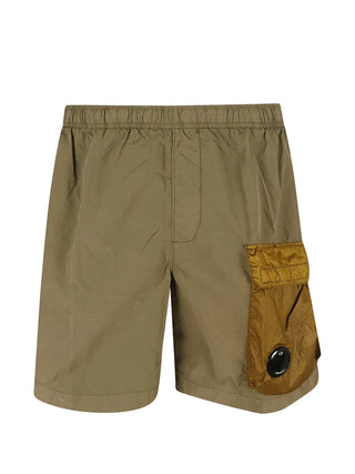 Engineered in mixed nylon with a signature lens pocket, these C.P. Company cargo swim shorts offer style, function, and quick-dry performance.