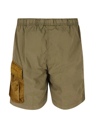 Engineered in mixed nylon with a signature lens pocket, these C.P. Company cargo swim shorts offer style, function, and quick-dry performance.