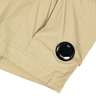 The C.P. Company 50 Fili Stretch Cargo Shorts, crafted from durable stretch cotton for superior comfort and iconic utility style. Available at our Lisbon store