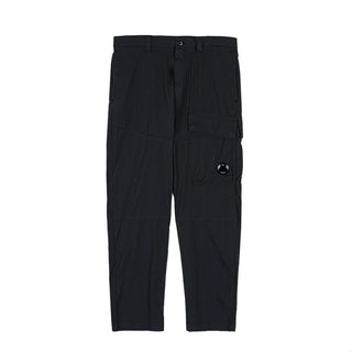C.P. Company cargo trousers, engineered for durability and style. Expertly crafted with signature pocket detailing and a contemporary silhouette.