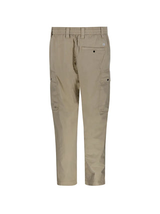 C.P. Company cargo trousers. Iconic utility wear with signature lens detailing. Durable fabric and functional pockets for everyday style. 