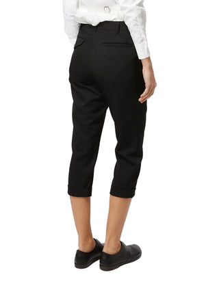 Black cropped trousers by Comme des Garcons