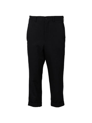 Black cropped trousers by Comme des Garcons