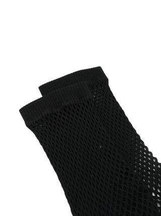 Black fishnet socks by Comme des Garcons