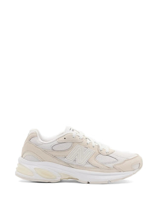 white and neutral mesh sneaker by Comme des Garcons Homme and X Newbalance 