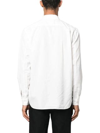 White long-sleeve shirt with black pants