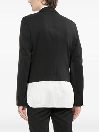 Black blazer with a white shirt underneath on a white background
