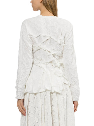 White ruffled top with a white skirt by Comme des Garcons
