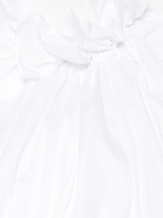 Close up of the neck detail on the white Come des Garcons ruffled blouse. 