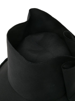 Close-up of a black hat with a wide brim by Comme des Garcons