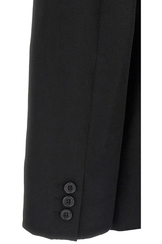 Black blazer sleeve with three button detail. 